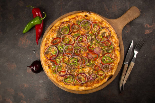 istock pizza with onion and vegetables on the rusty background 1485112052