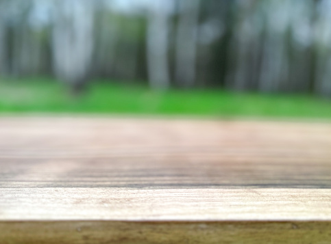 Empty wooden table, outdoors background