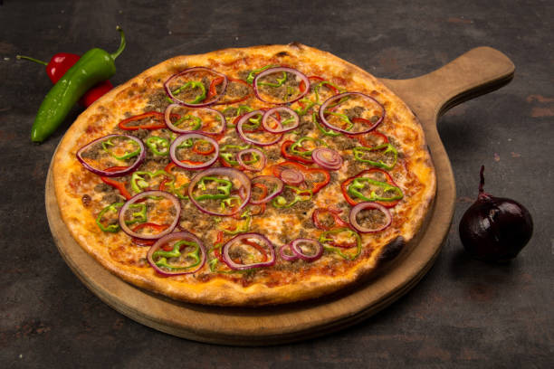 istock pizza with onion and vegetables on the rusty background 1485112870