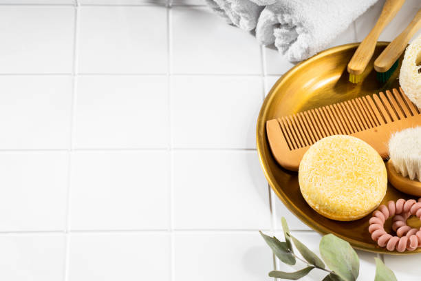 istock Solid shampoo bar and bathroom accessories lying on a white ceramic background. Sustainable hair care. Bathroom still life composition. Plastic free, zero waste, low water ingredients. Copy space 1485113526