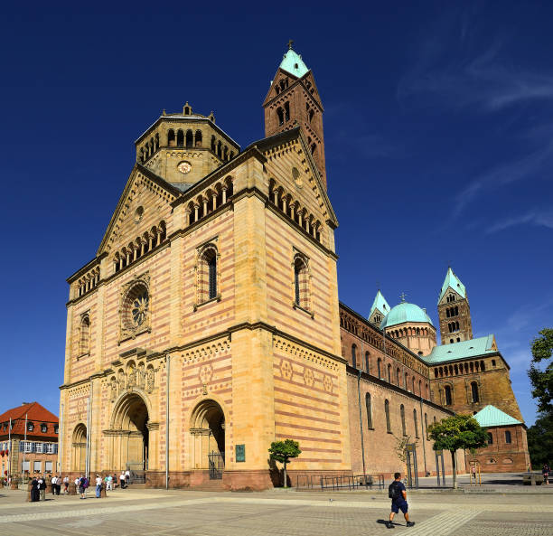Speyer, Germany - Main entrance, facade and cobbled Dom square (Domplatz) of the famous UNESCO world heritage Speyer Cathedral