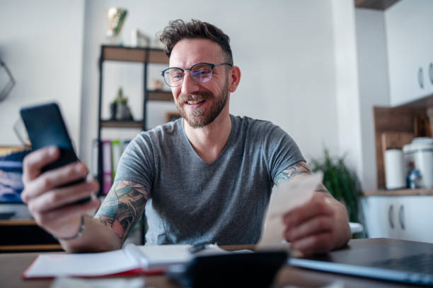 istock Man paying his bills from home. 1485116015