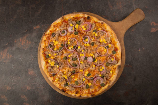 istock pizza with tomato and cheese on the rusty background 1485119393