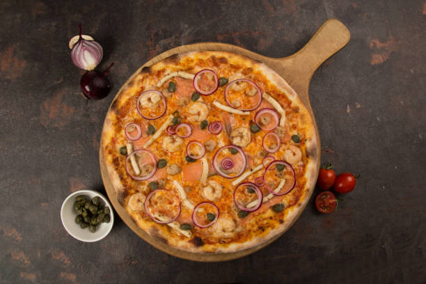 istock pizza with shrimps and bacon  and cheese on the rusty background 1485120575
