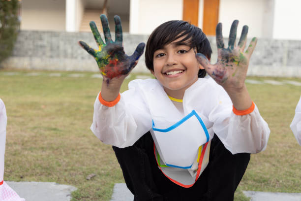 istock Happy boy with painted hands and looking camera, Elementary school student with draw coloring class concept 1485120891