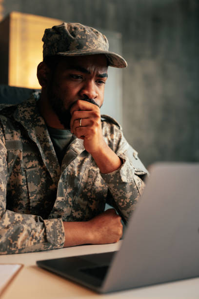 istock Serious military officer working on laptop. 1485123008