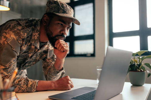 istock Pensive military officer working on laptop. 1485123036