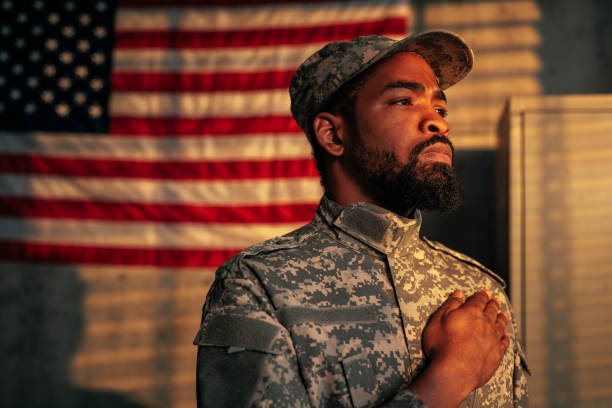 istock American soldier standing for national anthem. 1485123037