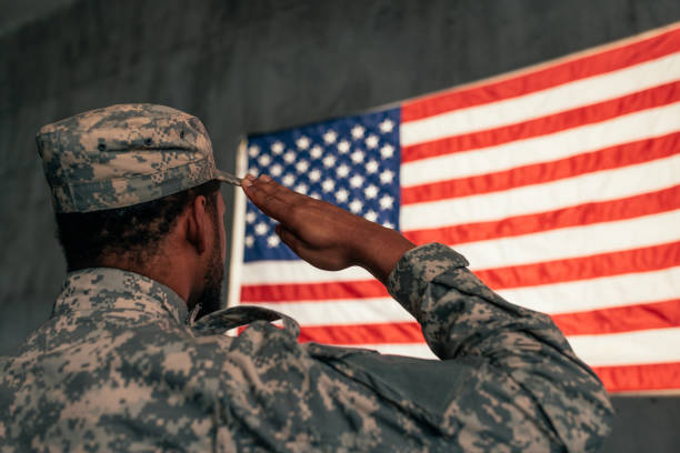 istock Army soldier saluting American flag. 1485123055