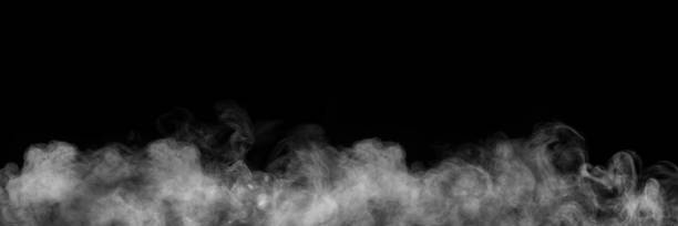 istock White horizontal smoke on black background. Dark backdrop, graphic resource for montage, overlay or texture 1485123772