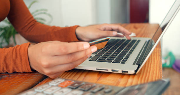 istock Online banking with smart phone. Lifestyle. Easy pay using smart phone or digital device. Communication via app for sale in shop. Woman shopping online on a sunny day with credit card. Hands close up. 1485124765
