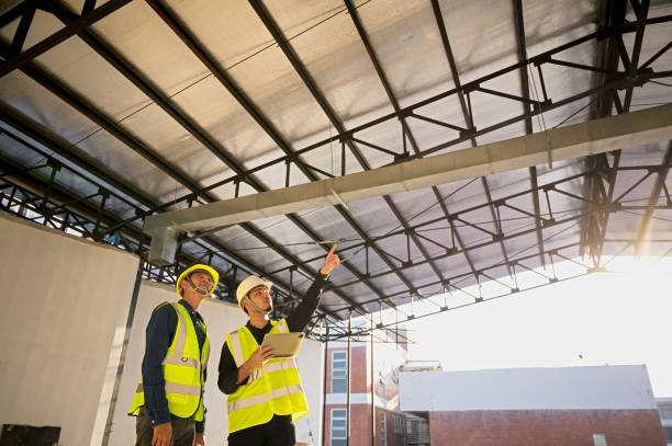 istock Civil Engineer and Construction Supervisor inspect the internal construction of building at construction site. Construction engineers or architect and Foreman inspect the construction inside building. 1485125635