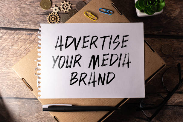 istock Closeup on notebook over vintage desk surface, letters making Build Your Personal Brand text. 1485125886