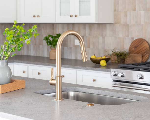 istock A gold kitchen faucet detail with cozy decorations. 1485126149