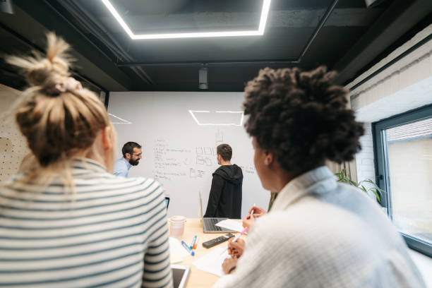 istock Coworkers brainstorming in a meeting 1485131450