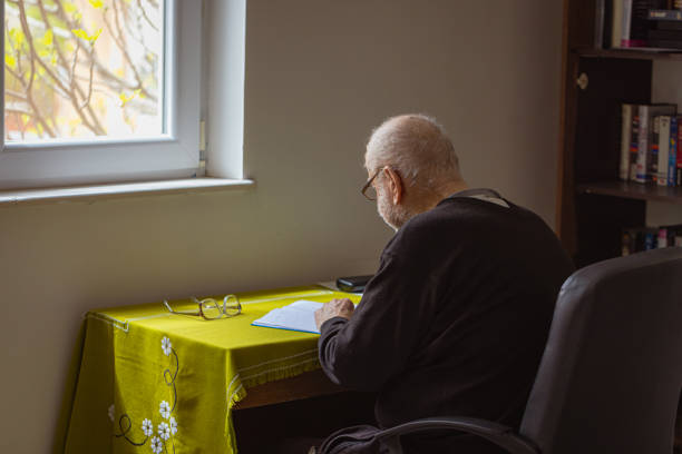 istock Senior Man with Dementia Writing to Remember Life's Journey 1485131678