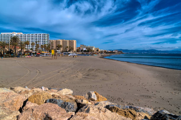 Benalmadena beach Playa de Fuente Salud next to the Marina with view to Carihuela and Torremolinas Spain stock photo