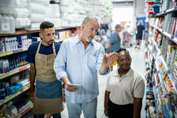 istock Manager talking to employees at the supermarket 1485132621