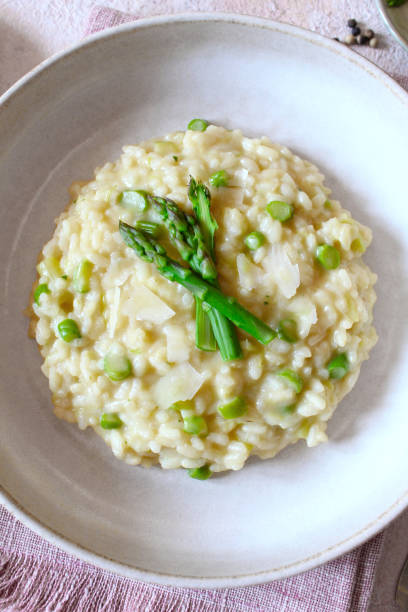 istock Italian risotto with asparagus and parmesan cheese. 1485133611