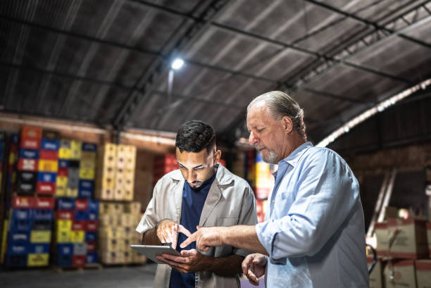 Manager talking to a employee at a storage room