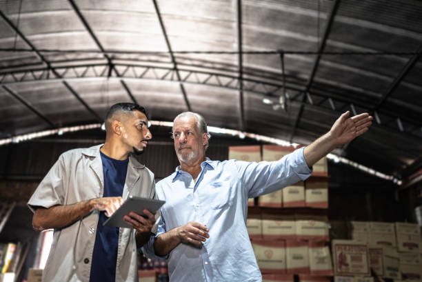 istock Manager talking to a employee at a storage room 1485135618
