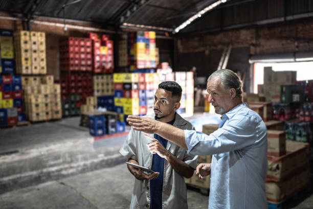 istock Manager talking to a employee at a storage room 1485135636