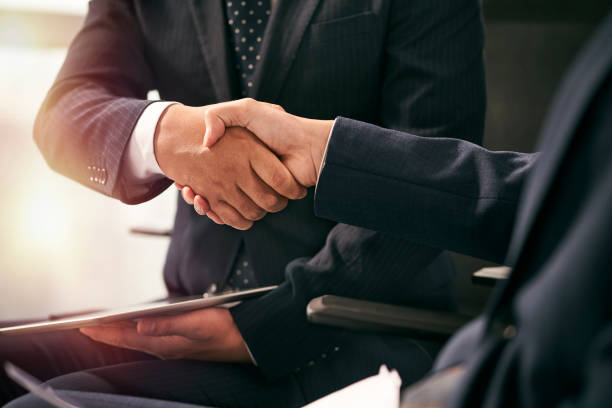 istock asian business people shaking hands in office 1485138901