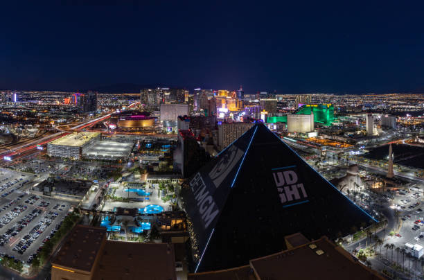 Las Vegas at Night Las Vegas, United States - November 24, 2022: A picture of Las Vegas at night, with the Strip at the far center and the Luxor Hotel and Casino pyramid at the bottom. las vegas pyramid stock pictures, royalty-free photos & images