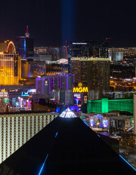 Las Vegas at Night - Luxor Hotel and Casino Pyramid Las Vegas, United States - November 24, 2022: A picture of the Las Vegas Strip at night, with the top of the pyramid of the Luxor Hotel and Casino on the bottom. las vegas pyramid stock pictures, royalty-free photos & images