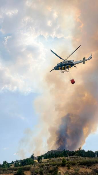 istock Helicopter working to extinguish a fire in a mountain area. 1485141282