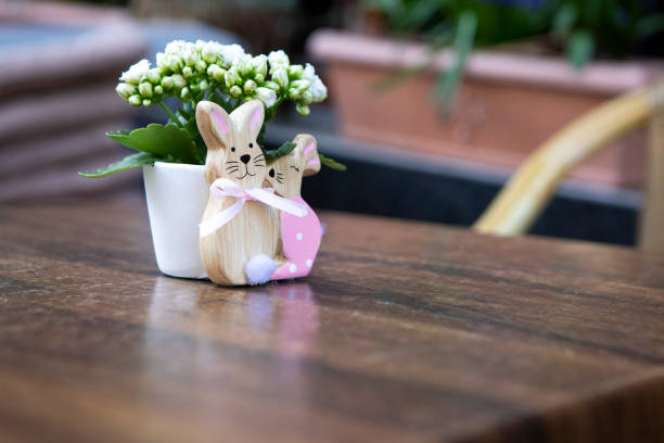 Easter bunny table decoration on a wooden table outside a bar