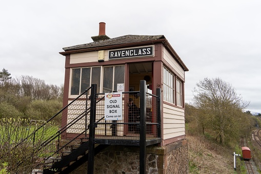 Ravenglass, United Kingdom – April 16, 2023: Old signal box by the railway station, now a small tourist attraction in Ravenglass, The Lake District, Cumberland, UK.