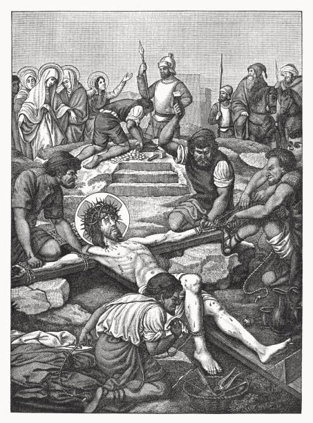 Jesus is nailed to the cross, wood engraving, published in 1898 Jesus is nailed to the cross. Wood engraving, published in 1898. nail cross stock illustrations