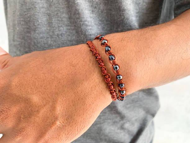 istock close up of a hand with wire copper bracelet. 1485149022