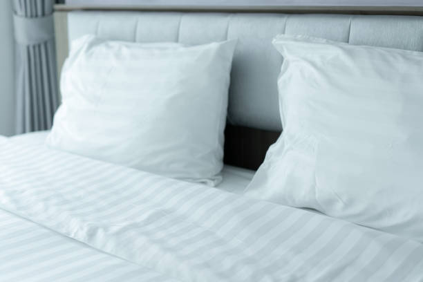 istock Clean Bedding sheets and pillow at hotel for traveler 1485149712