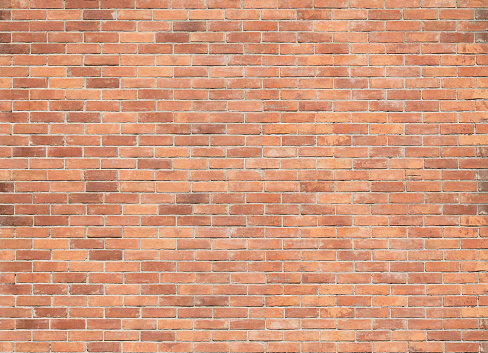 Red grunge bricks wall texture or background.