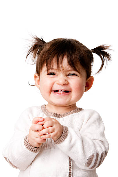 Happy laughing baby toddler girl Beautiful expressive adorable happy cute laughing smiling baby infant toddler girl with ponytails showing teeth, isolated. toddler photos stock pictures, royalty-free photos & images