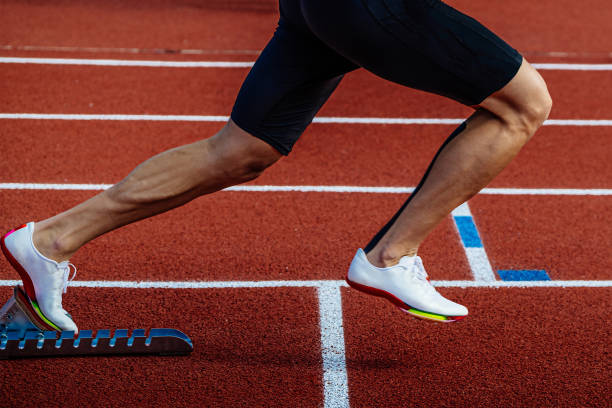 istock close-up legs runner start running from starting blocks on red track stadium, summer athletics championships 1485156050