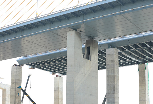 Large construction site. Suspension bridge execution of foundation.