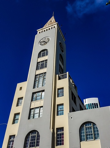 A majestic clock tower stands atop a grand building in San Francisco, California