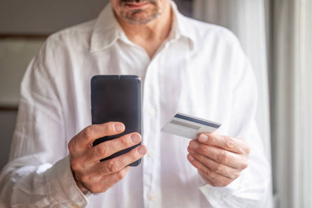 istock Man using his phone for online shopping 1485160699