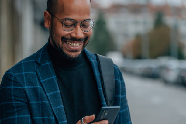 istock man looking at mobile phone in the street 1485165205