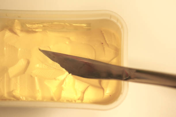 istock Knife in a tub of butter in kitchen 1485165231