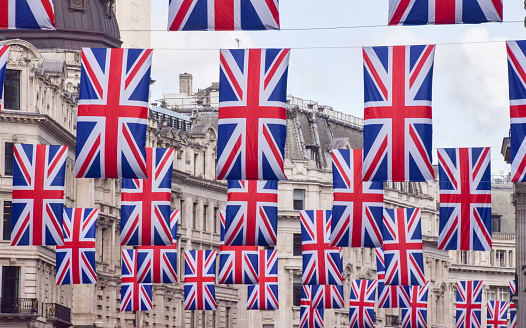 London, UK - April 25 2023: Regent Street lined with Union Jack flags ahead of the coronation of King Charles III.