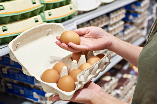istock Woman with packing eggs in shop 1485167226