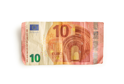 Crumpled €10 note against a white background