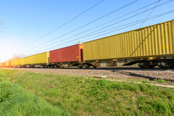 istock Freight train loaded with container in motion on a sunny day 1485167551