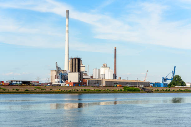 istock Waste-to-energy plant along a river at sunset 1485168023