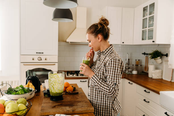 istock Girl drinking smoothie for breakfast at home 1485170578
