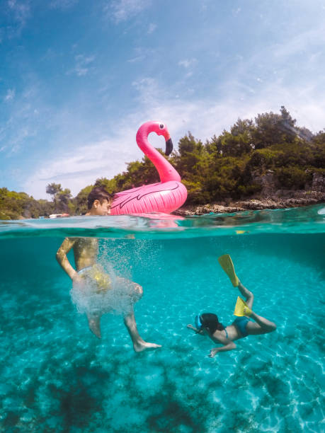 istock Child Having Fun In Crystal Clear Sea Water 1485170665